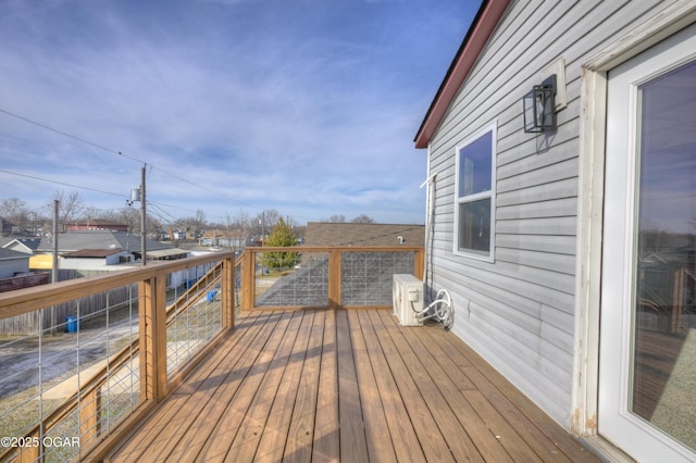 wooden terrace featuring a residential view