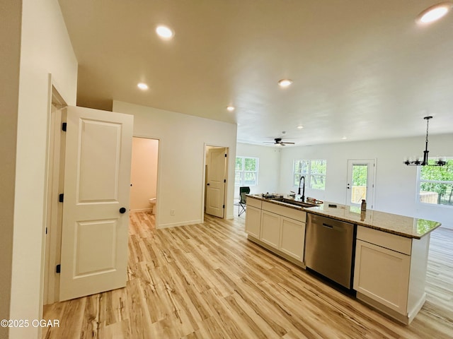 kitchen with a sink, recessed lighting, a center island with sink, dishwasher, and light wood-style floors
