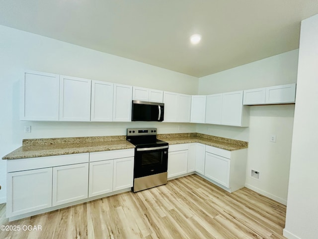 kitchen with stainless steel appliances, baseboards, light wood-style flooring, and white cabinets