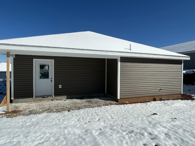 view of snow covered garage