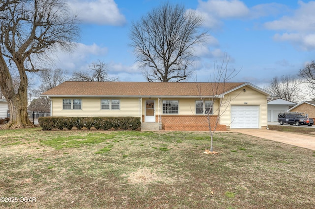 ranch-style house with an attached garage, driveway, a front yard, and brick siding