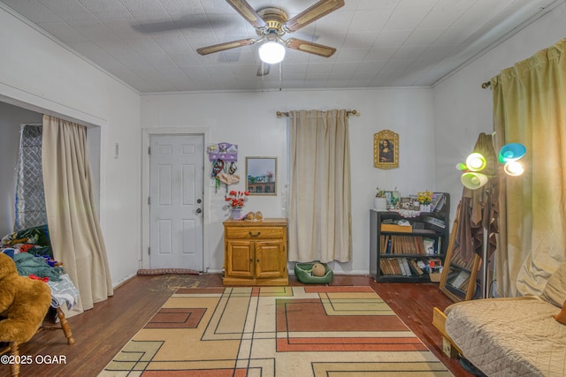 interior space with ornamental molding and dark wood finished floors