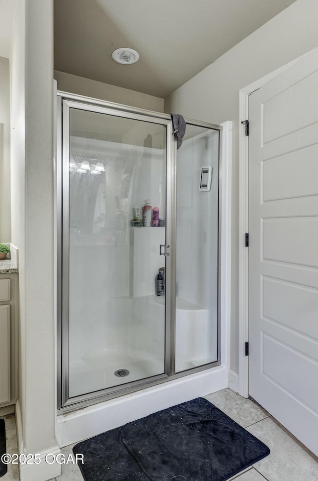 bathroom with a shower stall