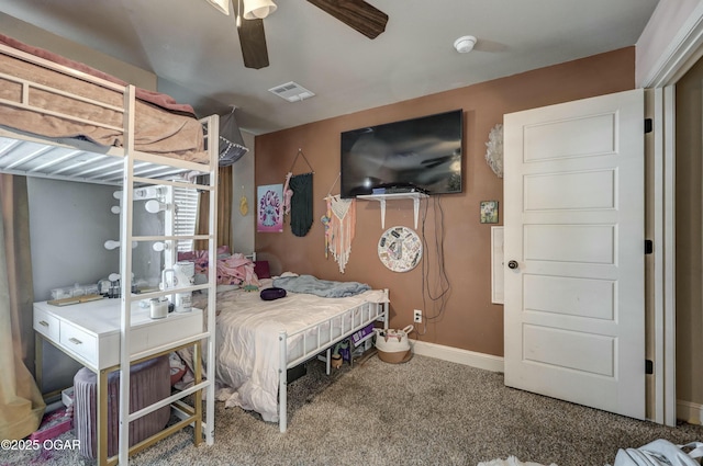 bedroom featuring a ceiling fan, carpet flooring, visible vents, and baseboards