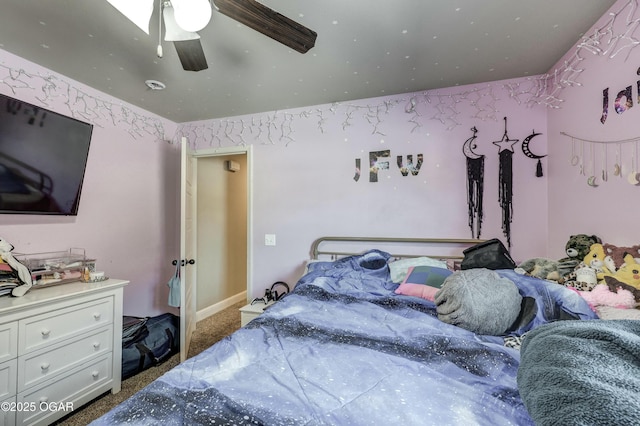 bedroom featuring dark colored carpet and a ceiling fan