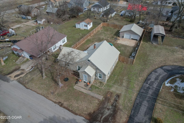 birds eye view of property with a residential view