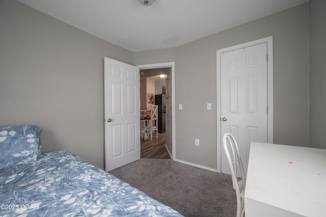 carpeted bedroom with baseboards