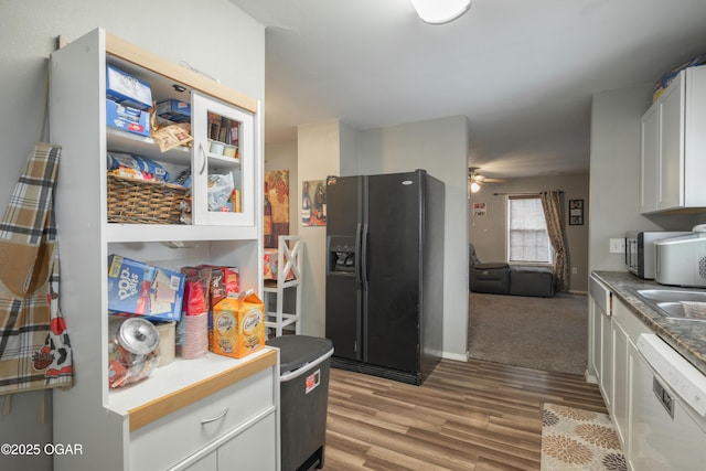 kitchen with ceiling fan, white cabinets, light wood-style floors, dishwasher, and black refrigerator with ice dispenser