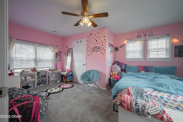 bedroom with visible vents, carpet floors, and ceiling fan