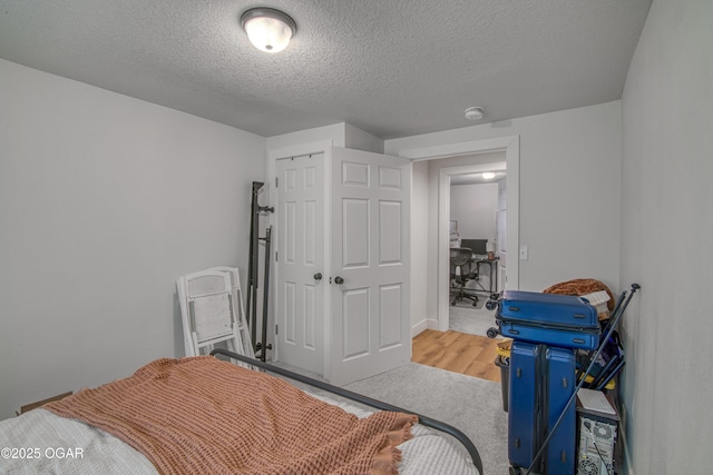 bedroom featuring a closet and a textured ceiling