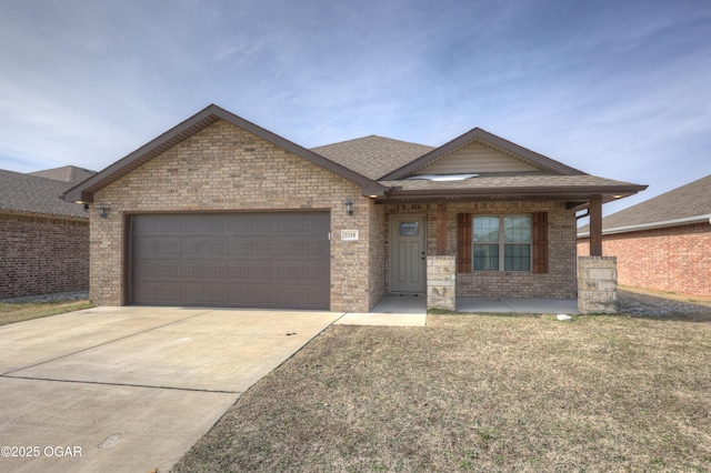 ranch-style home with an attached garage, brick siding, concrete driveway, roof with shingles, and a front yard