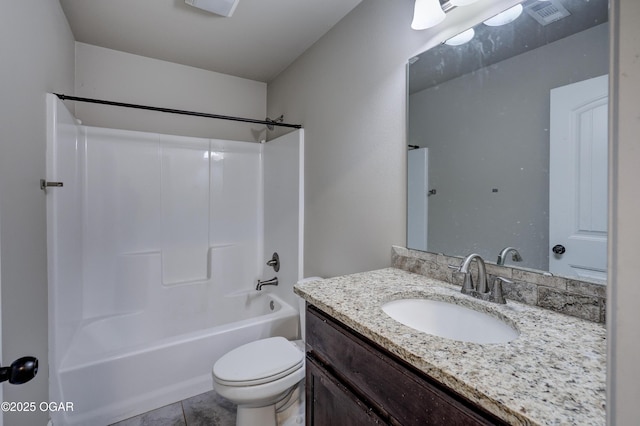 full bath with toilet, vanity, visible vents, shower / washtub combination, and tile patterned floors