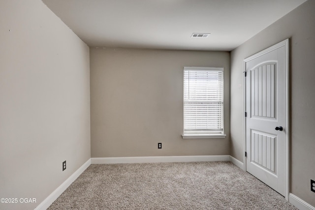 unfurnished room featuring light carpet, baseboards, and visible vents