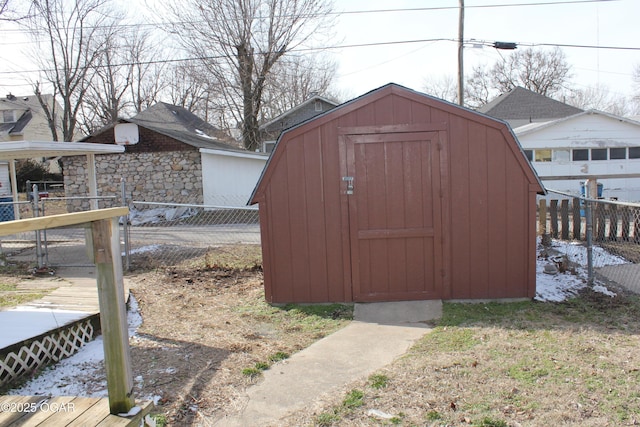 view of shed featuring fence