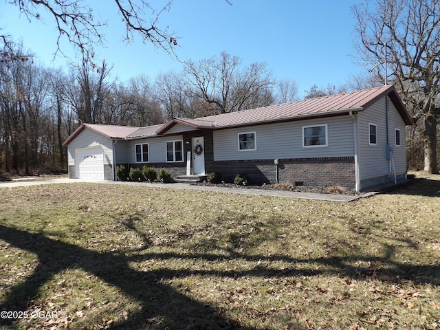 ranch-style house featuring metal roof, brick siding, a front lawn, and an attached garage