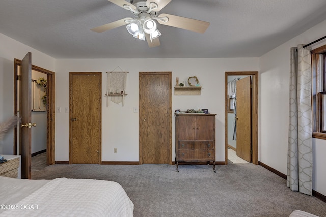 bedroom featuring ceiling fan, carpet floors, a textured ceiling, and baseboards