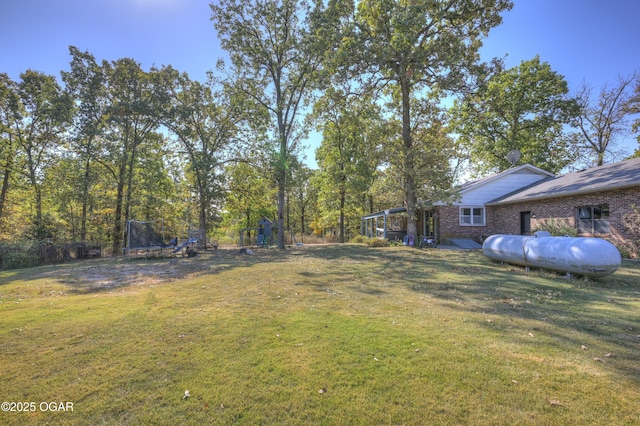 view of yard featuring a trampoline