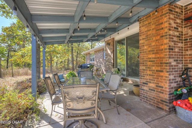 view of patio featuring outdoor dining area