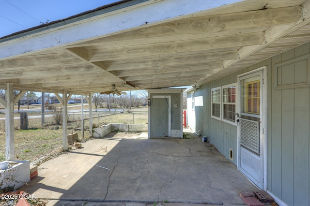 view of patio featuring fence