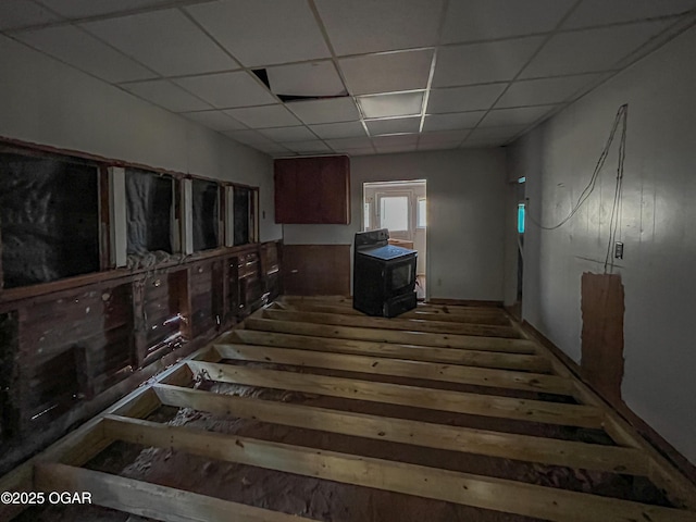 misc room featuring a paneled ceiling and wood-type flooring