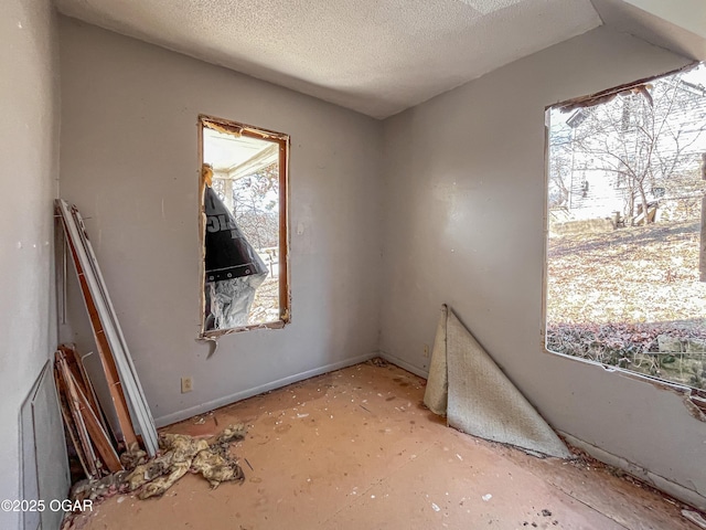 spare room featuring a textured ceiling