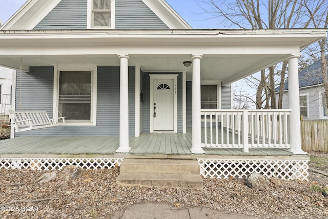 doorway to property with a porch