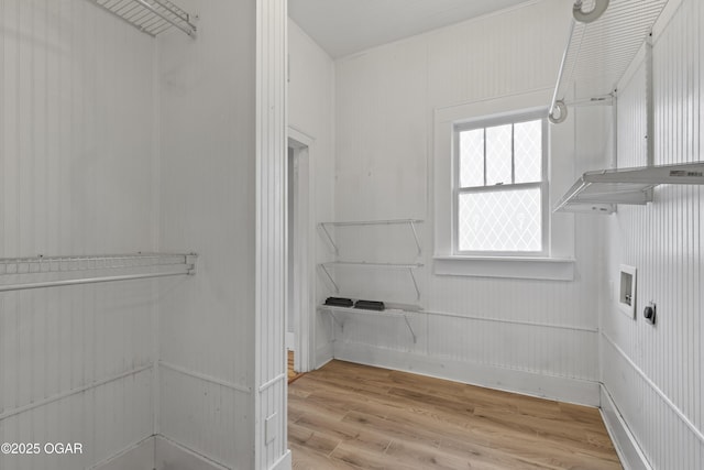 walk in closet featuring wood finished floors