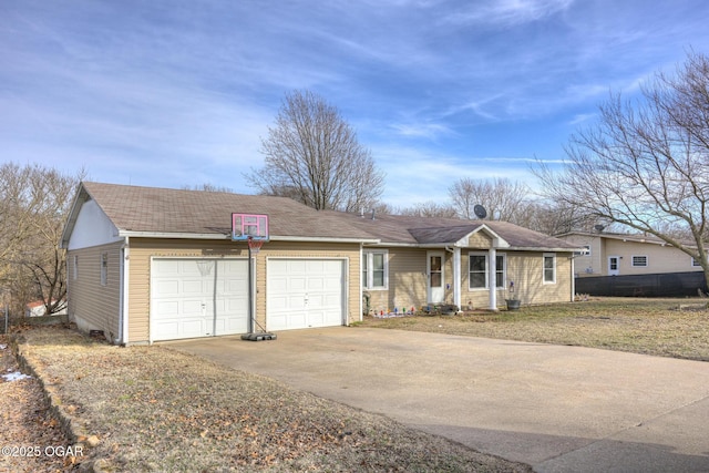 ranch-style house with a garage and concrete driveway