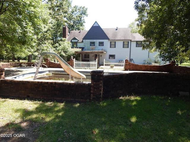 4415 Mcclelland Park Rd, Joplin, MO 64804 - rear view of house featuring a chimney