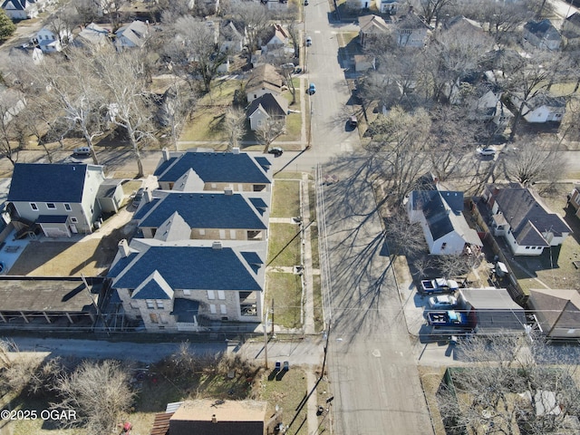 birds eye view of property with a residential view