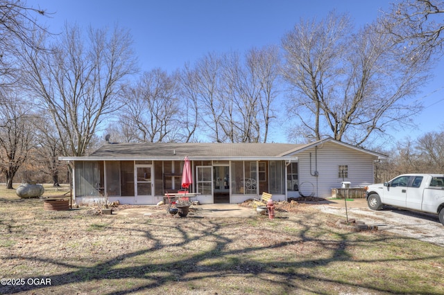 view of front of property with a sunroom