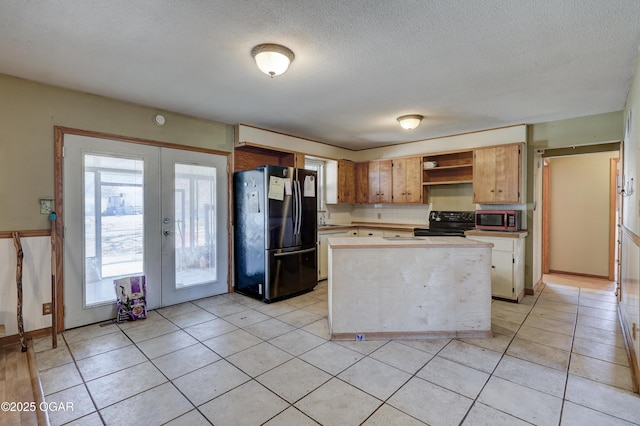 kitchen featuring french doors, light tile patterned floors, open shelves, light countertops, and black appliances