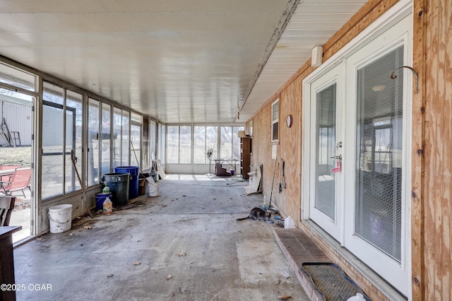 unfurnished sunroom featuring plenty of natural light