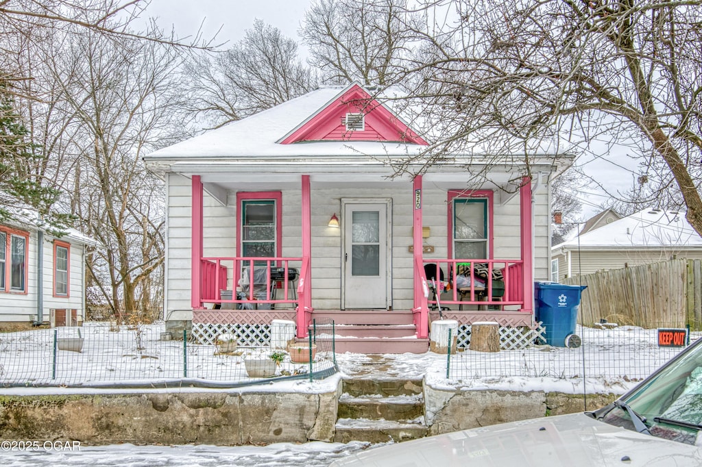 920 W A St, Joplin, MO 64801 - view of front facade with covered porch and fence