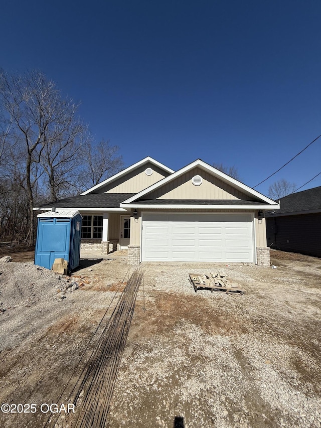 view of front facade with driveway and an attached garage