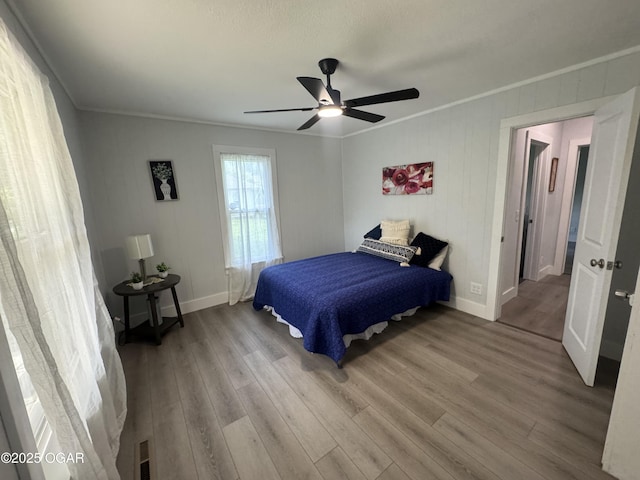 1711 Missouri Ave, Joplin, MO 64804 - bedroom featuring crown molding, wood finished floors, and ceiling fan