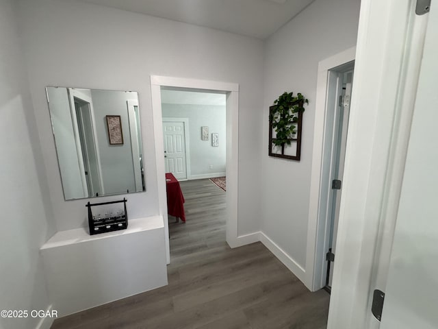 1711 Missouri Ave, Joplin, MO 64804 - hallway featuring dark wood-style floors and baseboards