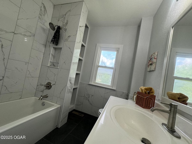 1711 Missouri Ave, Joplin, MO 64804 - bathroom with plenty of natural light, vanity, bathtub / shower combination, and tile walls