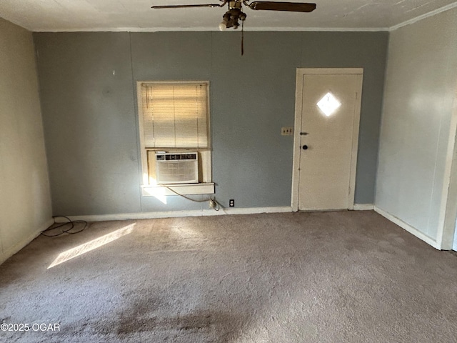 carpeted foyer entrance featuring ceiling fan, ornamental molding, cooling unit, and baseboards