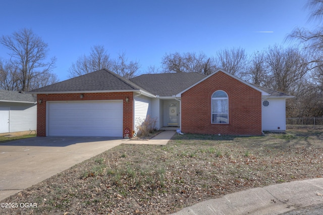 single story home with a garage, brick siding, driveway, and a shingled roof