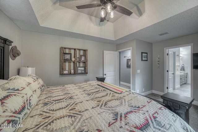 107 Oak Leaf Ter, Joplin, MO 64804 - carpeted bedroom featuring a textured ceiling, a raised ceiling, visible vents, and baseboards