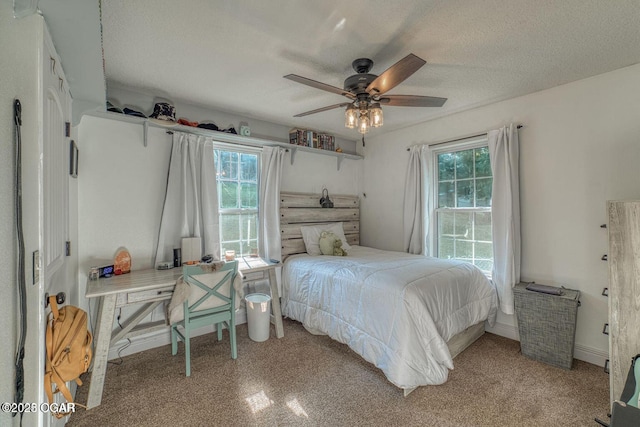 107 Oak Leaf Ter, Joplin, MO 64804 - bedroom with a textured ceiling, multiple windows, a ceiling fan, and baseboards