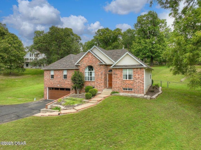107 Oak Leaf Ter, Joplin, MO 64804 - single story home featuring a front lawn, aphalt driveway, and brick siding