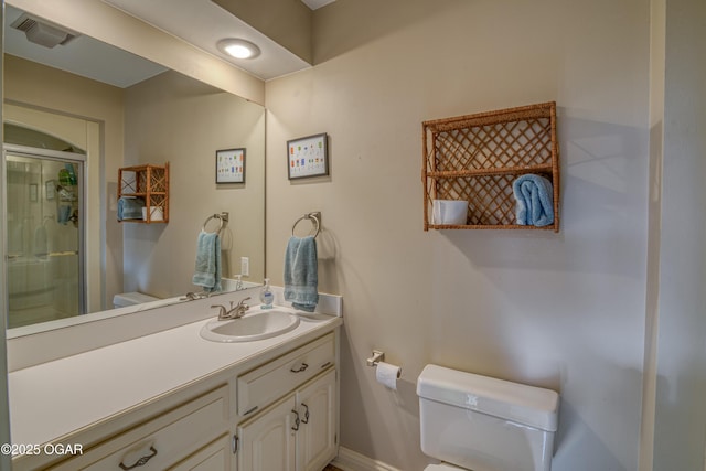 bathroom featuring a stall shower, visible vents, vanity, and toilet