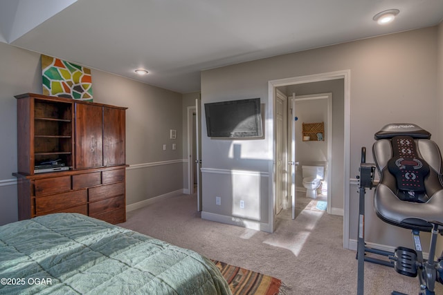 bedroom with light carpet and baseboards