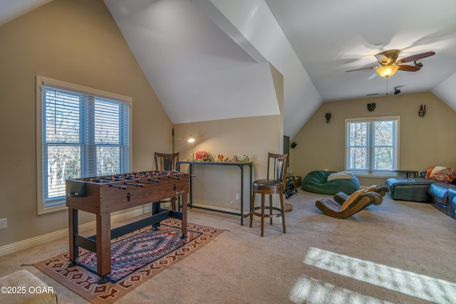 playroom featuring vaulted ceiling, carpet flooring, a ceiling fan, and baseboards