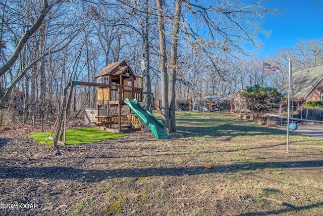 communal playground featuring a lawn