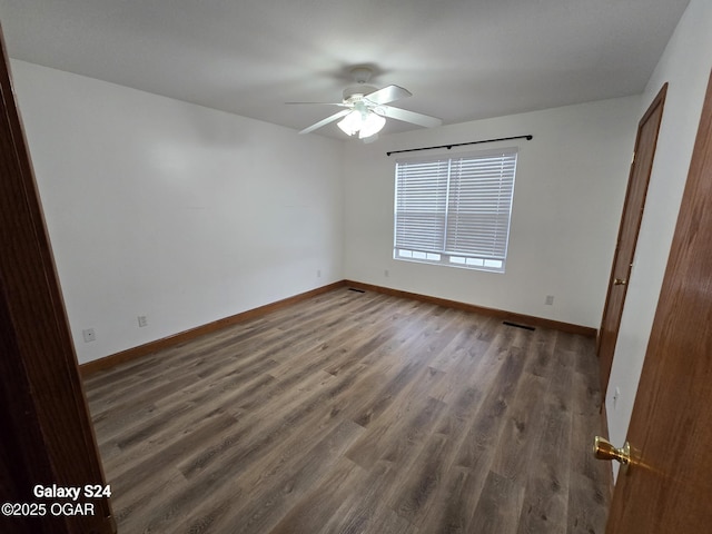 unfurnished bedroom with ceiling fan, baseboards, and wood finished floors