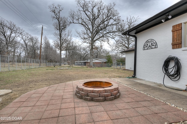 view of patio / terrace featuring an outdoor fire pit and a fenced backyard