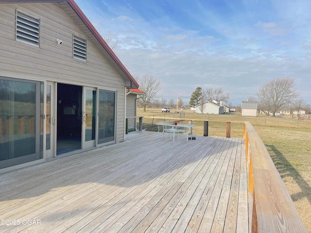 wooden deck with a yard